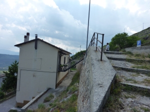 The step-bridge that Vittoria crosses to get from her house to the road.